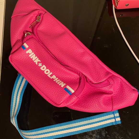 pink dolphin fanny pack